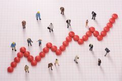 Up-trending graph made of pills.