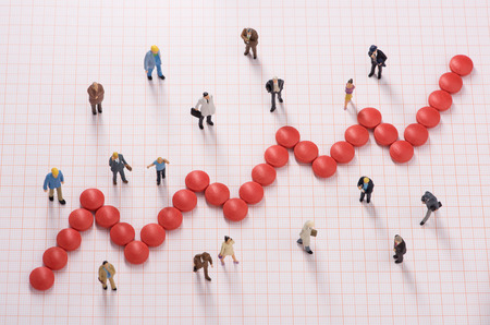 Up-trending graph made of pills.