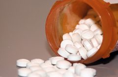 Overturned bottle of pills.