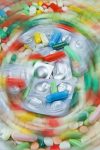 Lots of pills on a blurred background expressing danger of addiction.
